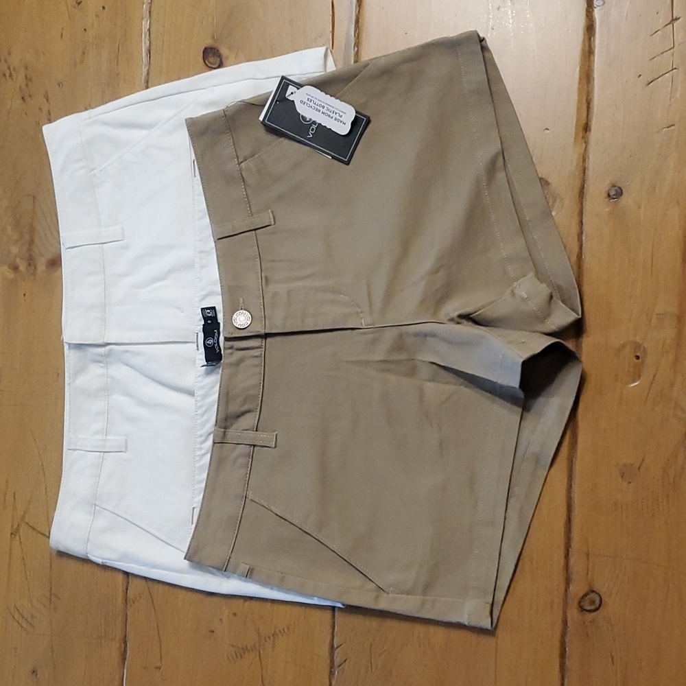 Two volcom Chino style shorts, brown are size 5 nwt and white are size 27